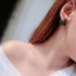 Swan Crystal Earrings worn by a woman, showcasing a stylish swan design with sparkling cubic zirconia.