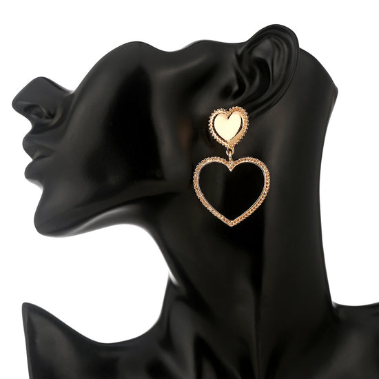 Heart shaped stud earrings gold hollow heart design
