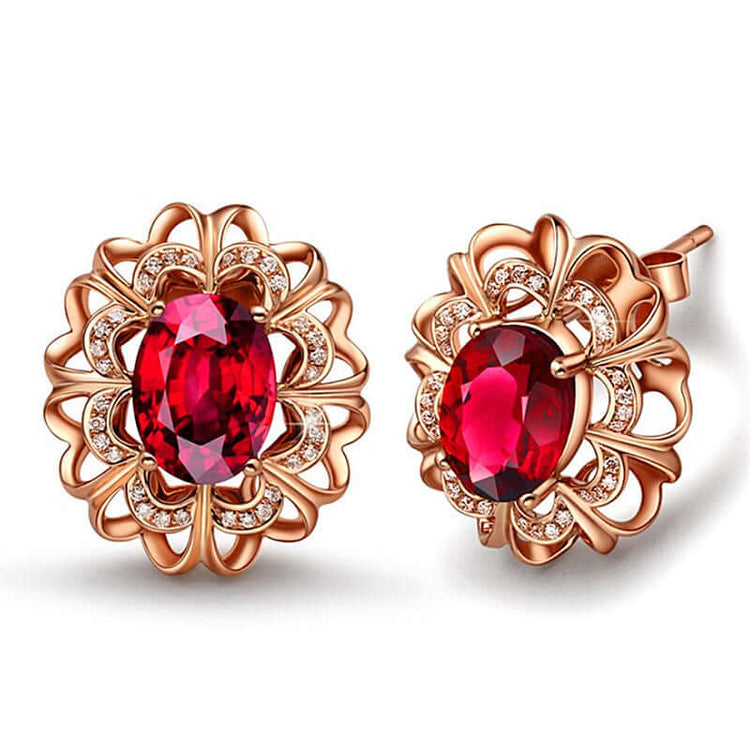 18K Gold Tourmaline Earrings showcasing a stunning geometric design with red stones and intricate floral patterns.